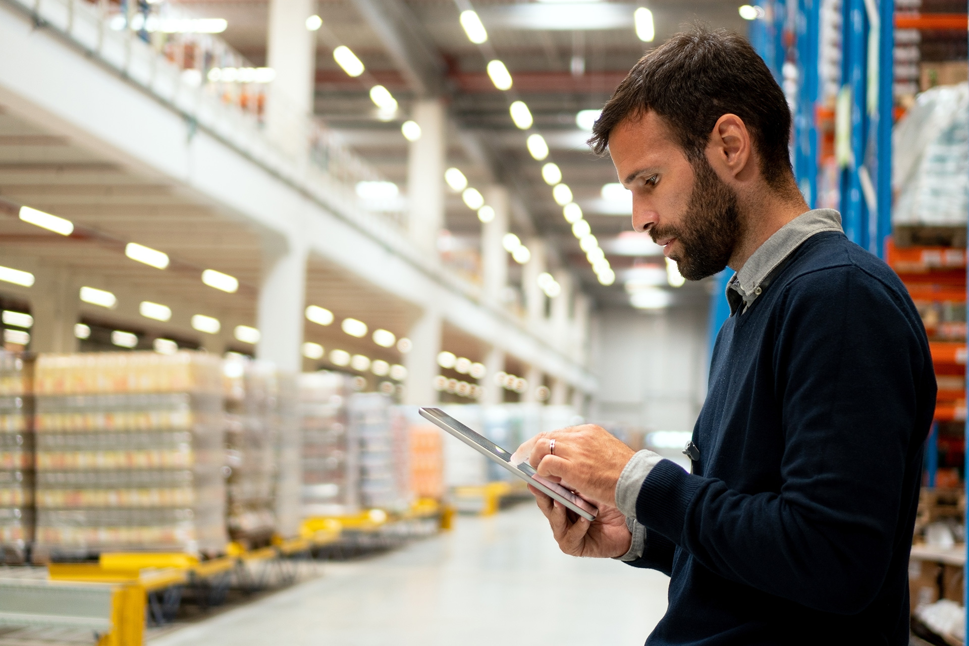 Warehouse manager working on a digital tablet