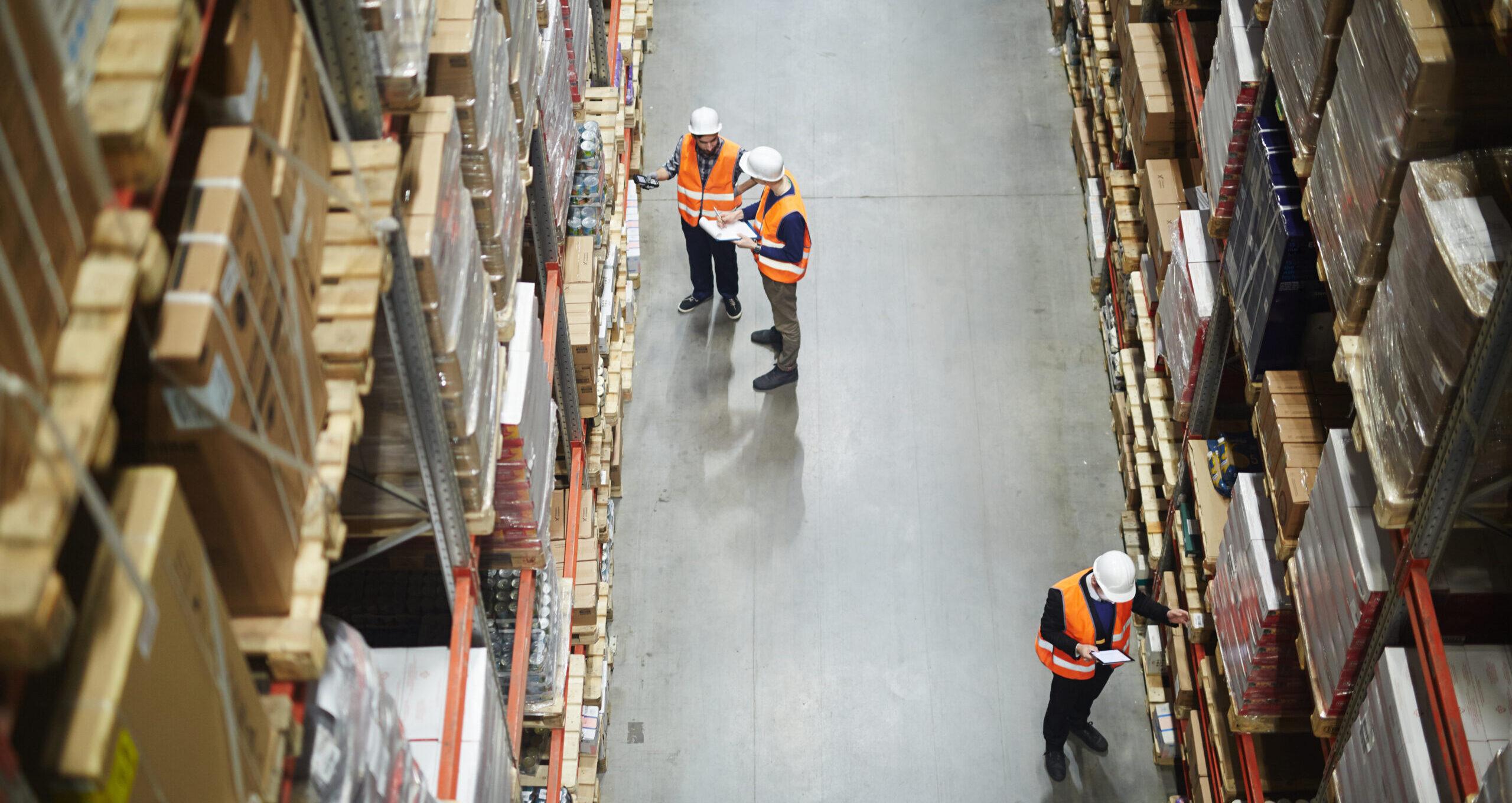 Warehouse workers checking inventory