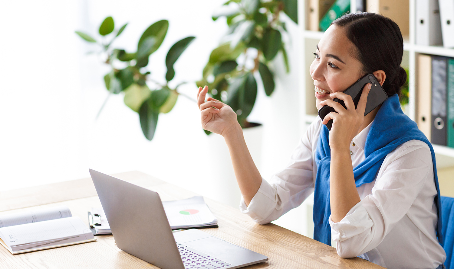 Asian woman talking on phone about annual pricing agreements